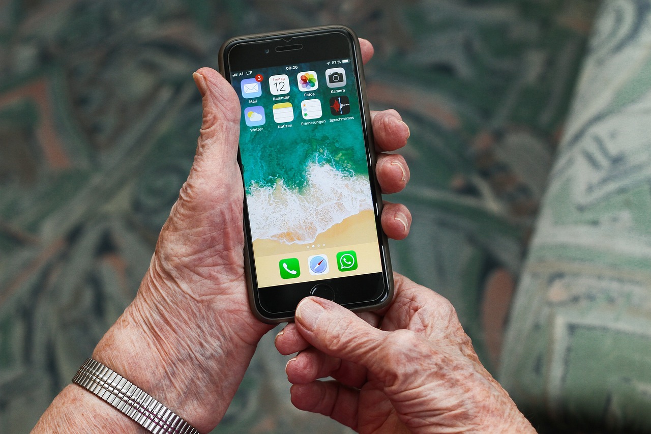 a older adult holding a phone